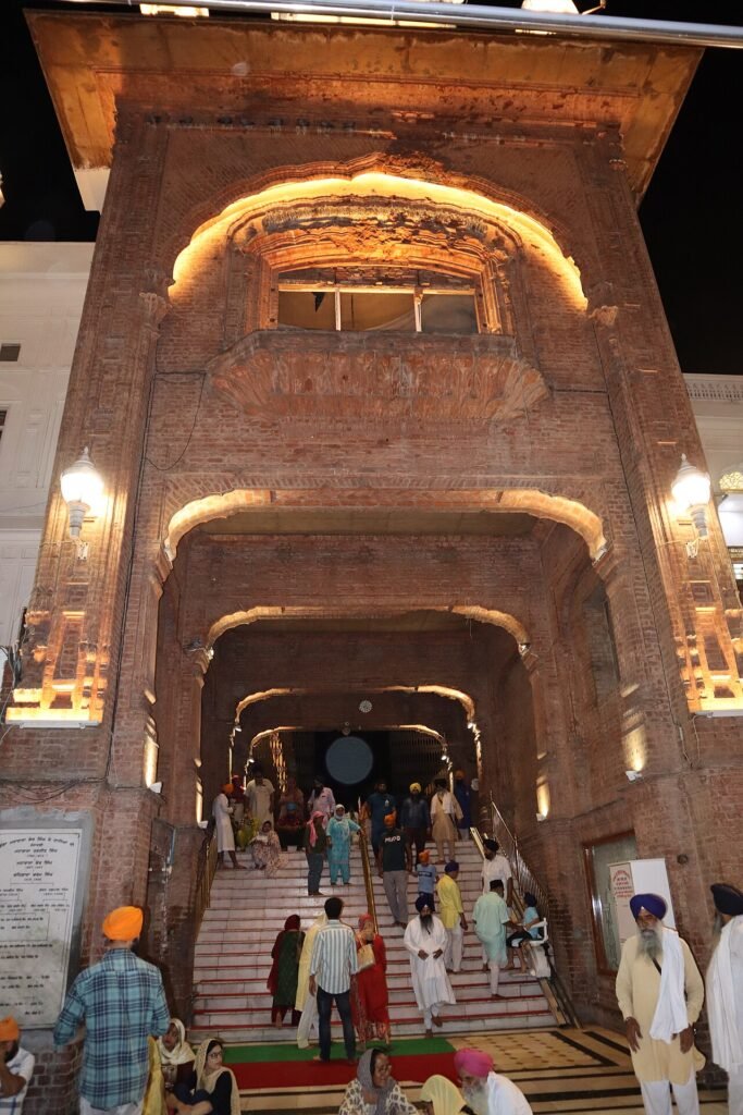 Photograph of a bullet-hole marked old entry-way into the Golden Temple complex, Amritsar, Punjab, India, April 2023.jpg — related to The Wound That Gold Cannot Heal