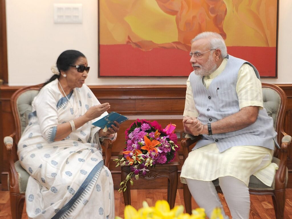 Playback singer Asha Bhosle meets PM Modi.jpg — related to The Songs Nobody Else Wanted