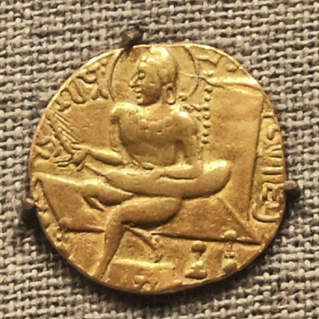 Samudragupta’s celebrated lyrist-type gold coin, showing the emperor playing a stringed instrument.