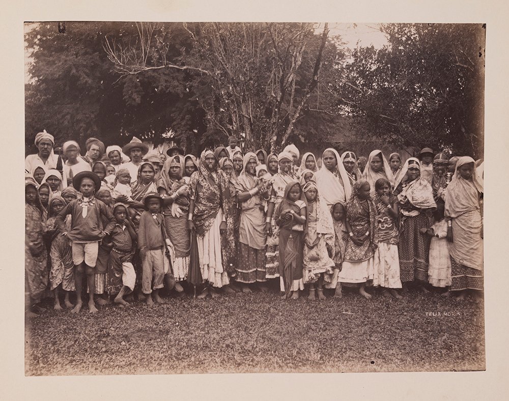 Historical group portrait of Indian-heritage women men and children in Trinidad in the 1890s.