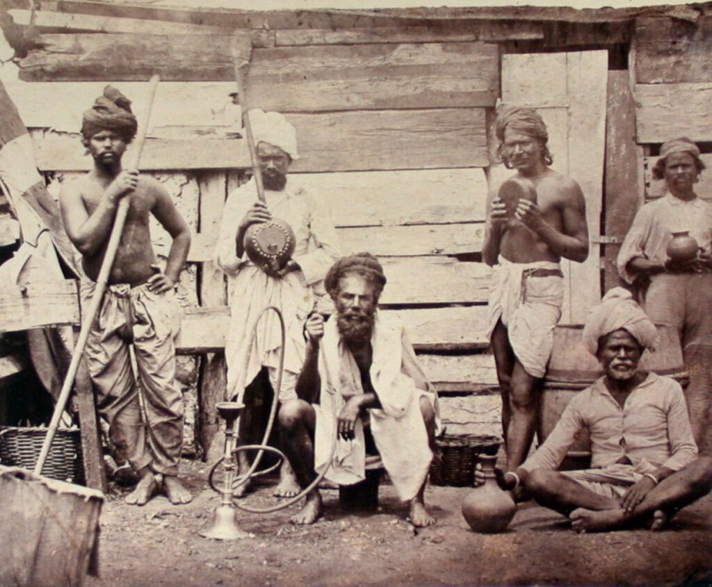 Archival image of Indian indentured workers on a sugar estate in Mauritius in 1870.