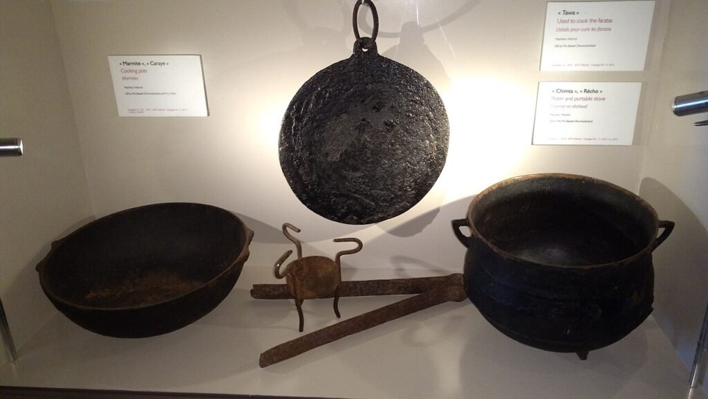 Historical cooking vessels displayed in the Aapravasi Ghat museum.