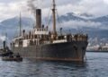 AI-generated historical illustration of a passenger steamship anchored in Vancouver harbour in 1914, representing the Komagata Maru