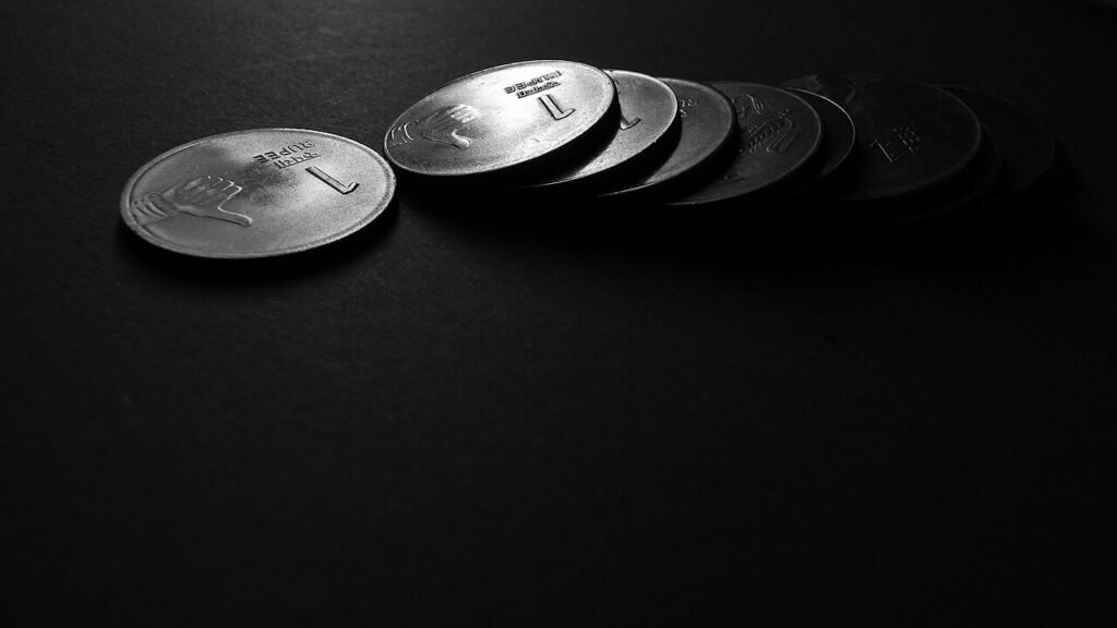 Different Indian one-rupee coins shown side by side.