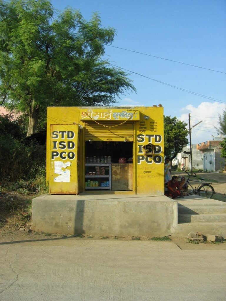 Photograph of a public call office in India.